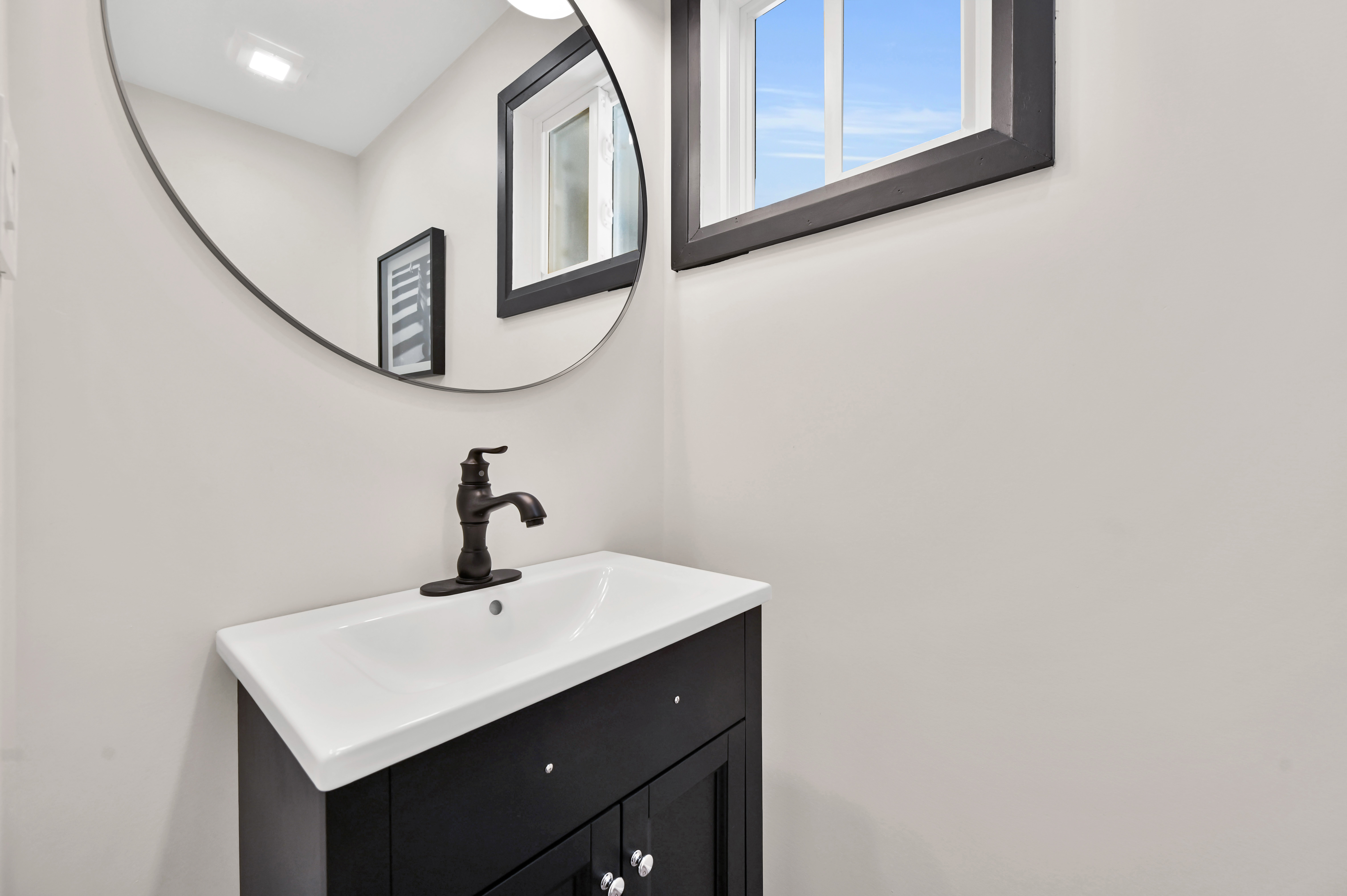 Bright finished powder room with modern fixtures and clean styling — excellent portfolio shot — Kron, Hamilton | MTC Renovations